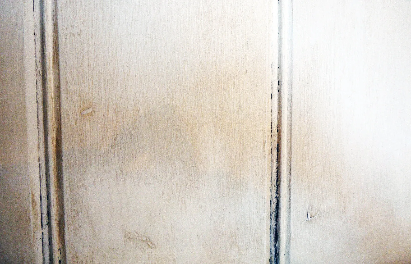 Vintage carved oak kitchen dresser painted in a soft cream and distressed and antique glazed for a vintage finish