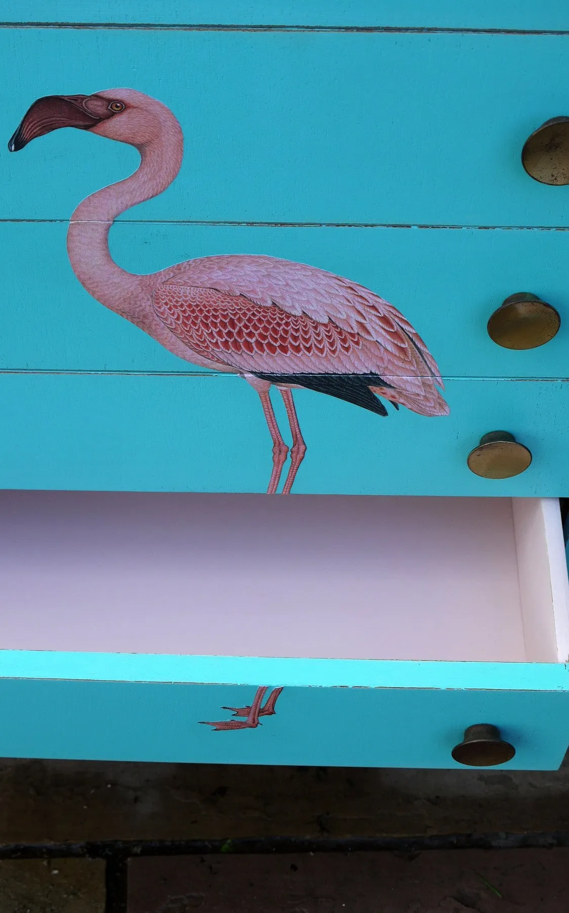 Vintage mid century children's chest of drawers painted in azure blue with pink flamingo design